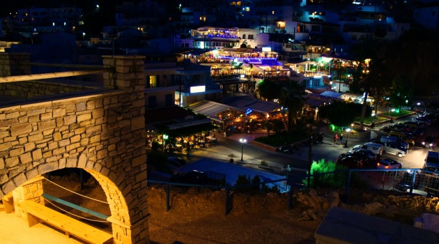 Night view of Agia Galini village with lights reflecting over the harbour