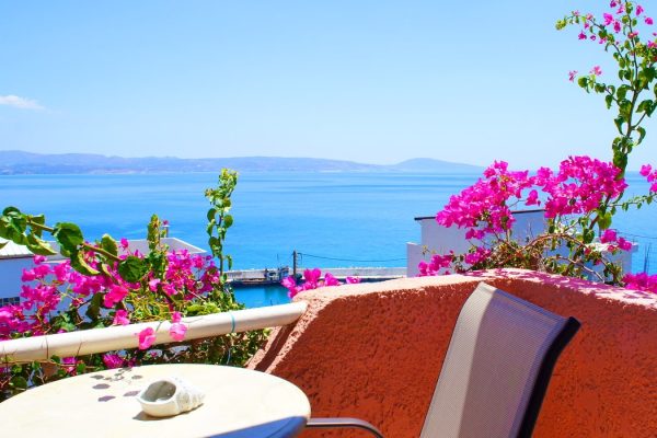 Sea-view balcony with bougainvillea at Hotel IDI in Agia Galini